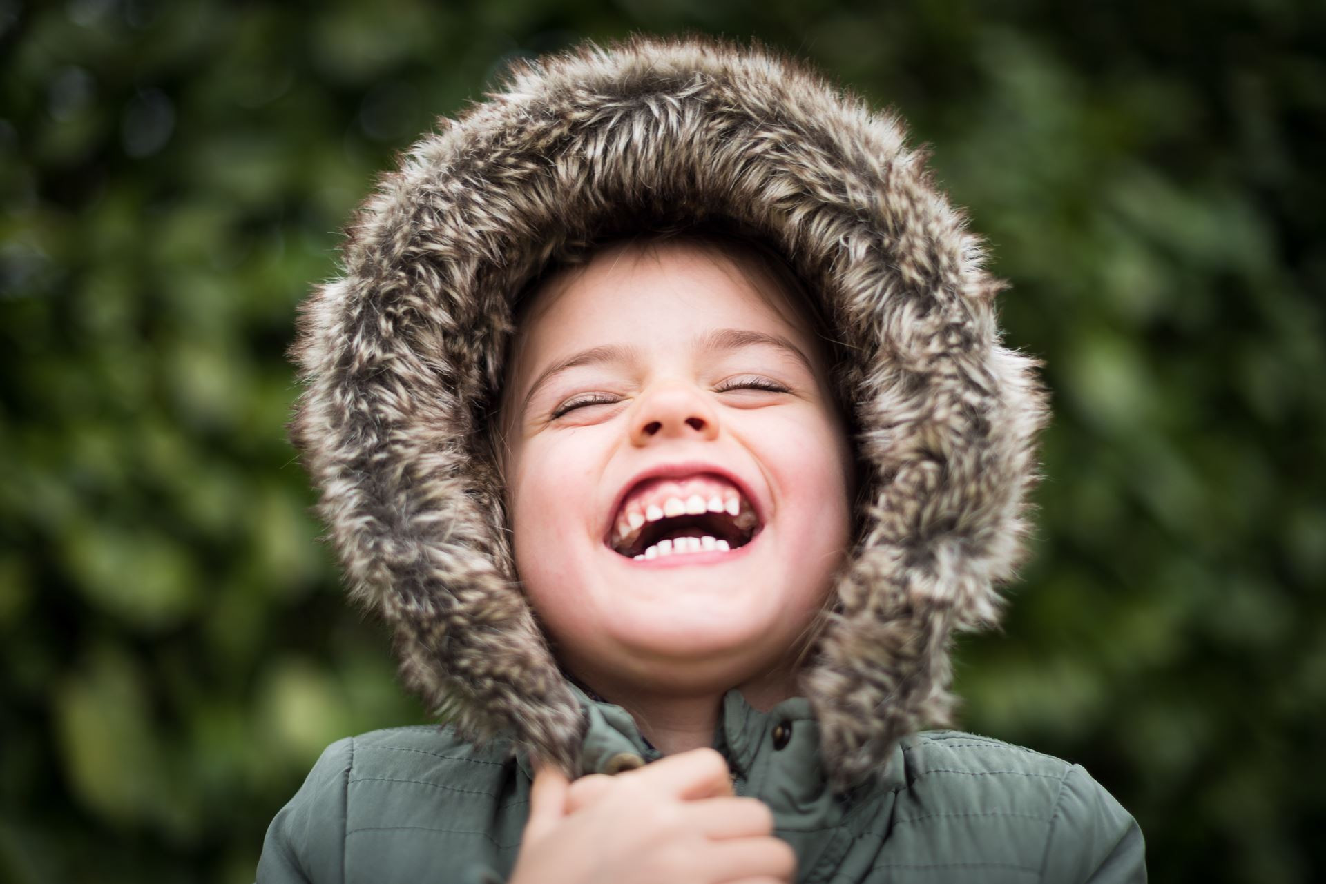 a close up of a boy with his mouth open